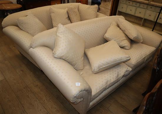 A pair of large cream brocade two seater settees W.204cm